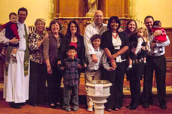 Three families were at Trinity to receive grants to help defray the cost of their adoptions.