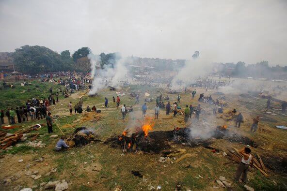 Hundred of funeral pyres were started throughout the cities and countryside to provide mass cremation of the victims. Photo - Agence France-Presse